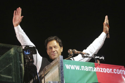 FILE - Former Pakistani Prime Minister Imran Khan waves to his supporters during an anti government rally, in Lahore, Pakistan, April 21, 2022.  AP/RSS Photo